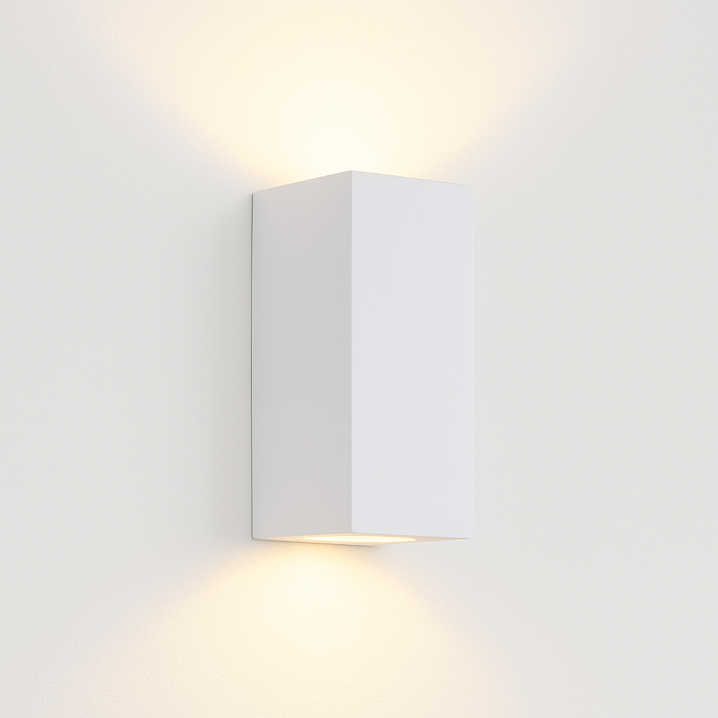 Adelong modern white rectangular wall light on white background with warm up and down glow.