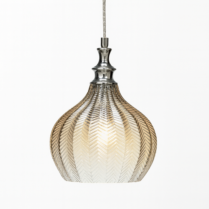 Bedford cognac glass pendant light with chrome detail on white background.