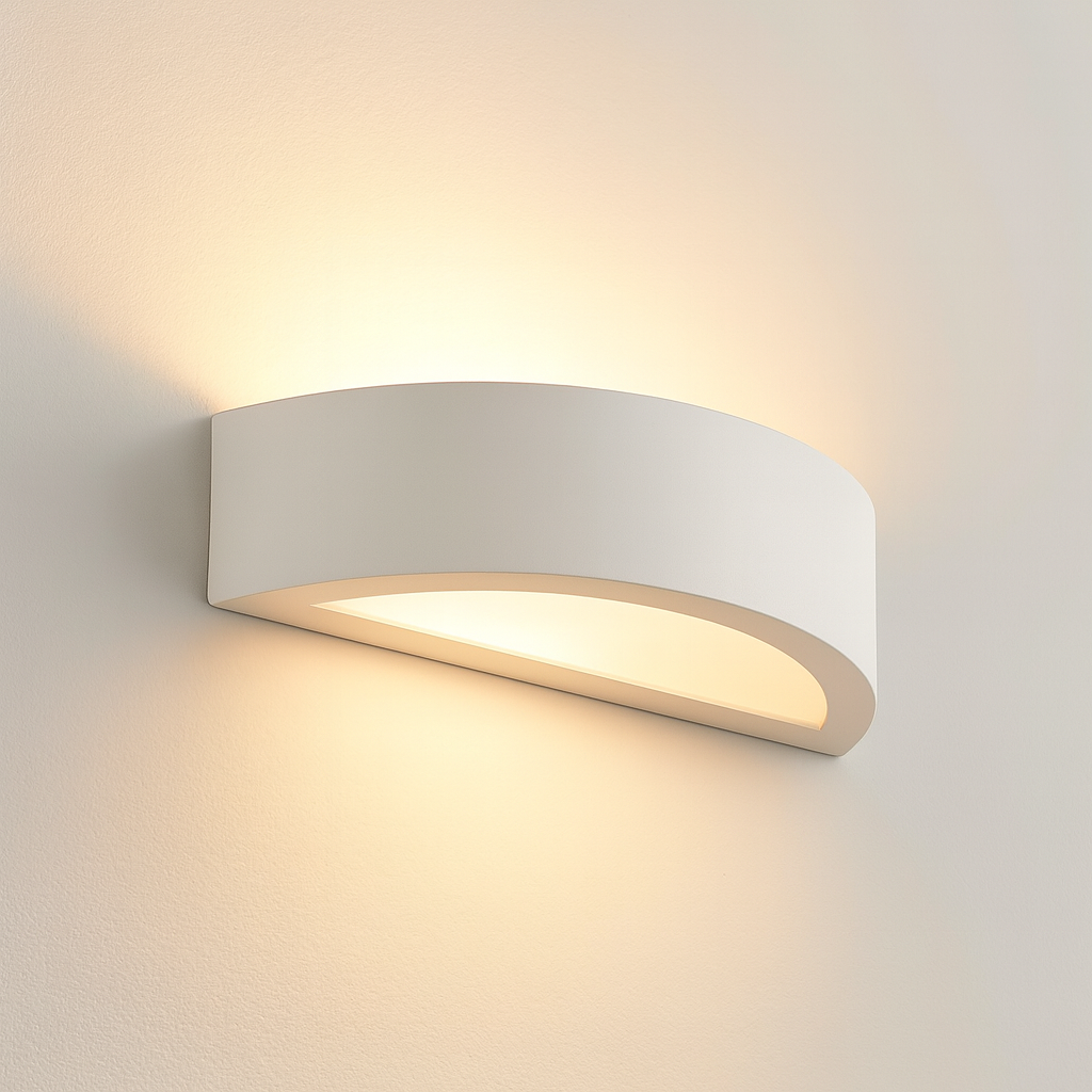 Bega wall light in a smooth white finish, mounted on a white wall with warm upward and downward glow.