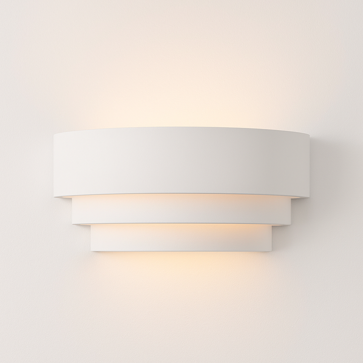 Borden white wall light – modern layered design, 31cm wide, emits soft up and down glow against white wall.