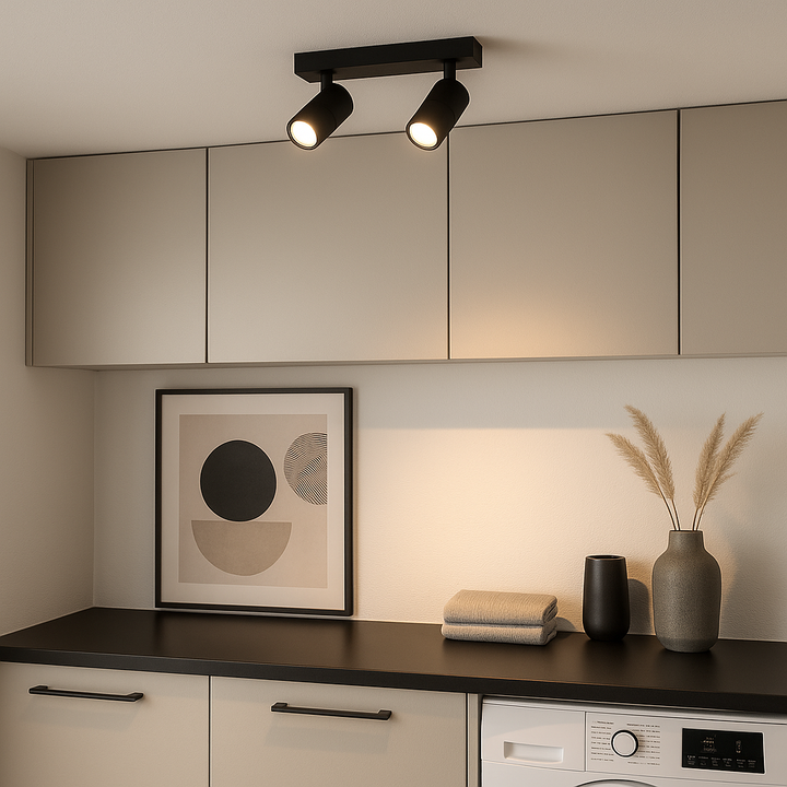 Black 2-light ceiling spotlight bar in modern utility room.