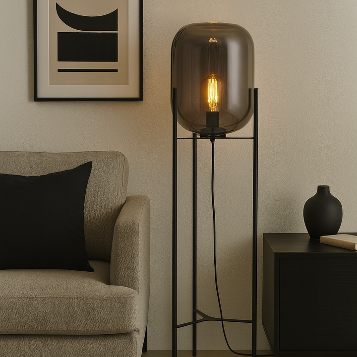 Modern living room with Camden smoked glass floor lamp 118cm tall and black accents beside a neutral sofa