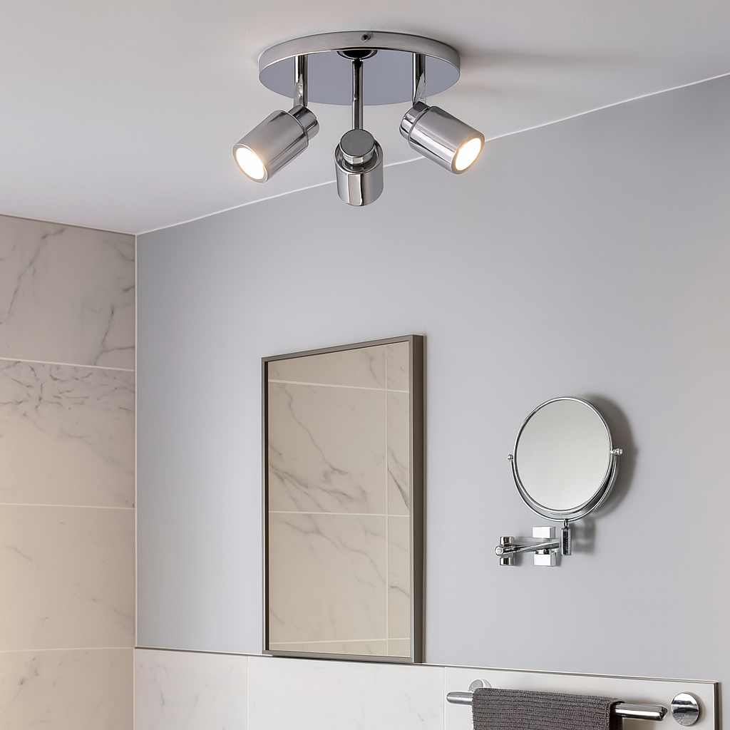 Chrome 3 light spotlight in a modern bathroom with marble tiles and mirror – compact ceiling light for stylish bathroom lighting