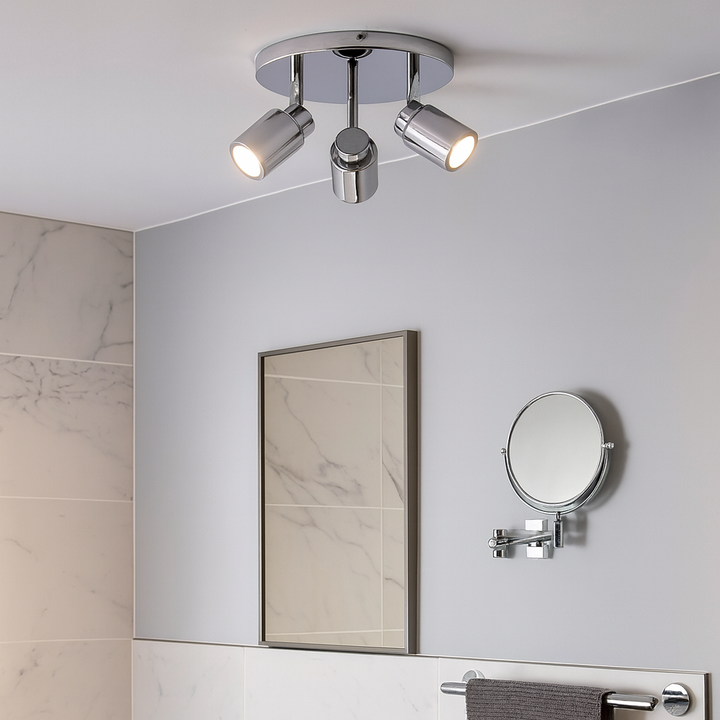 Chrome 3 light spotlight in a modern bathroom with marble tiles and mirror – compact ceiling light for stylish bathroom lighting