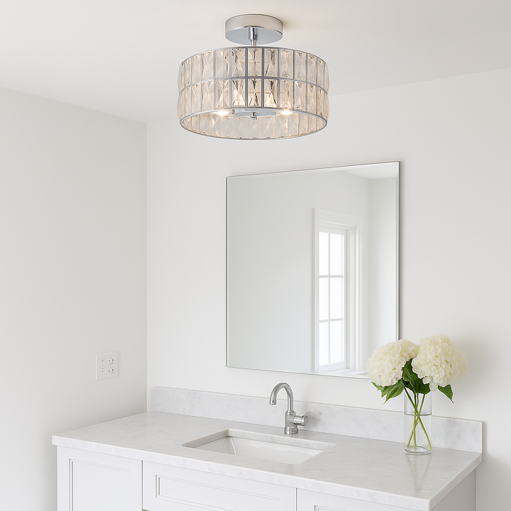 Crystal drum flush ceiling light with chrome frame in a bright bathroom with white walls, marble vanity and mirror