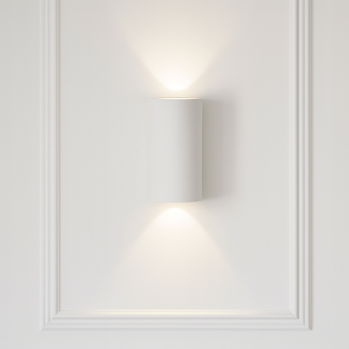 Denham paintable ceramic wall light with up and down glow