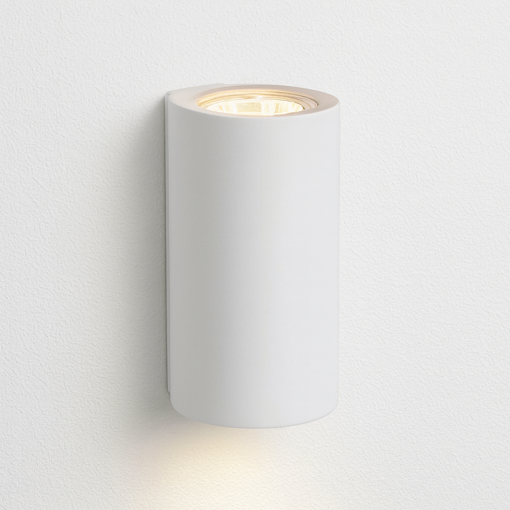 Denham modern white cylindrical wall light on a clean white wall background