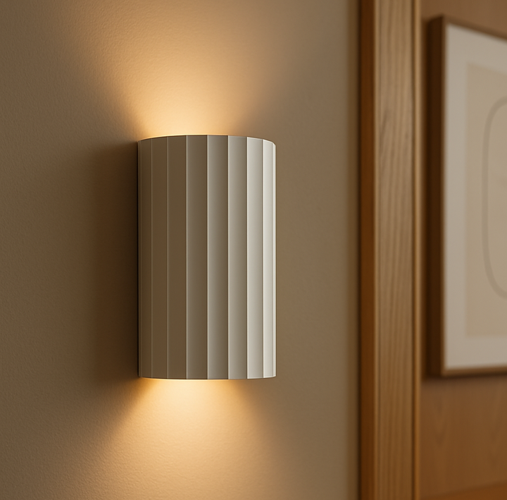 Digby wall light illuminated, casting soft light both upwards and downwards for ambient glow