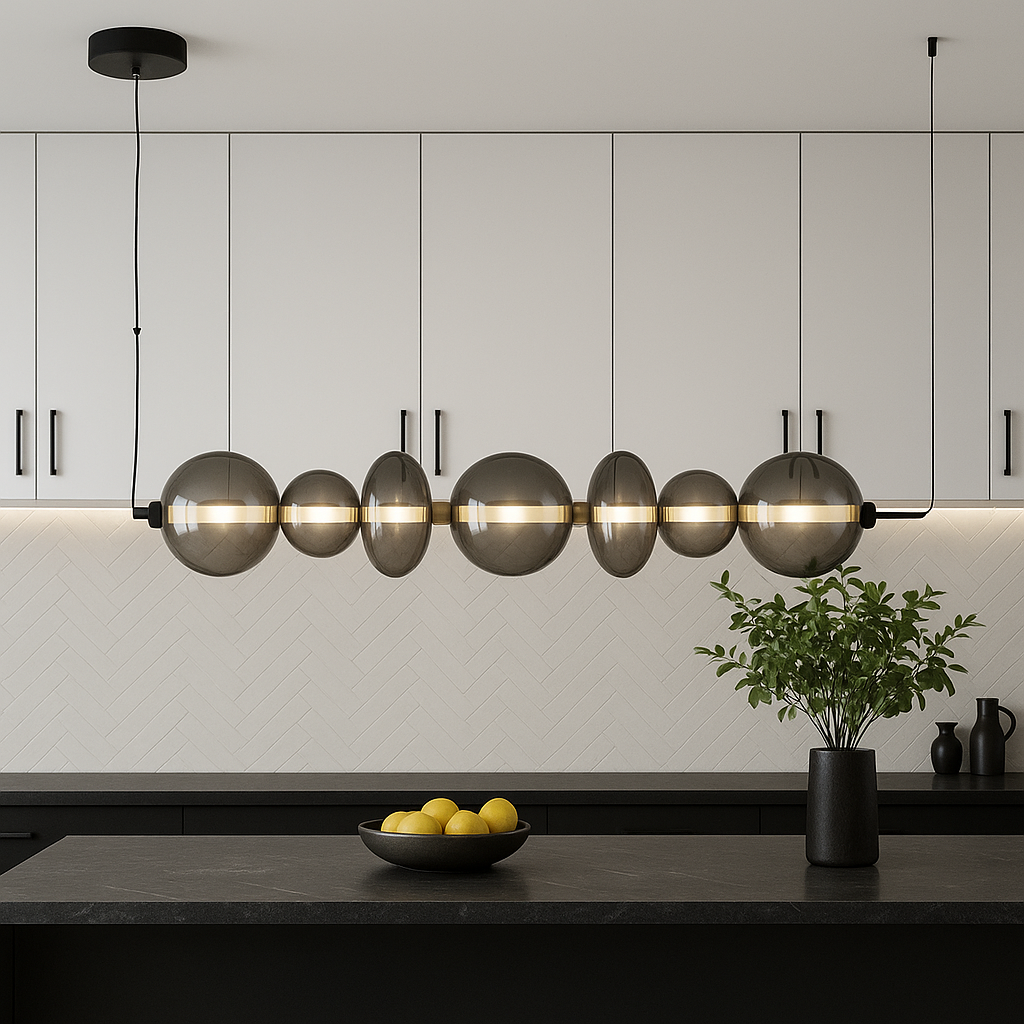 Europa Lighting black glass pendant bar light hanging in a modern kitchen with white upper cabinets, black accents, and a wide marble island
