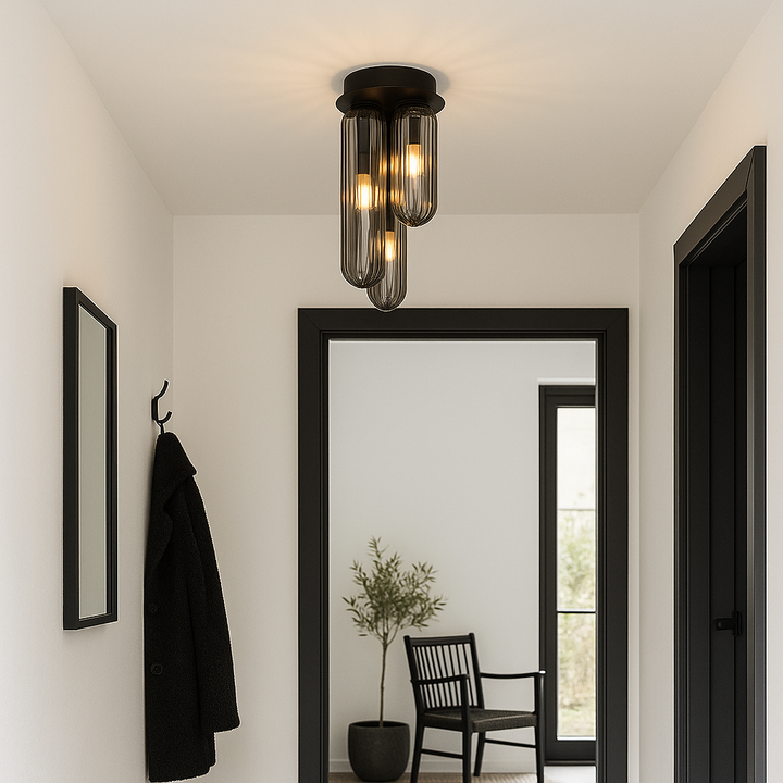 Florence flush ceiling light with smoked ribbed glass shades and black frame styled in a modern Nordic hallway with white ceiling and black accents