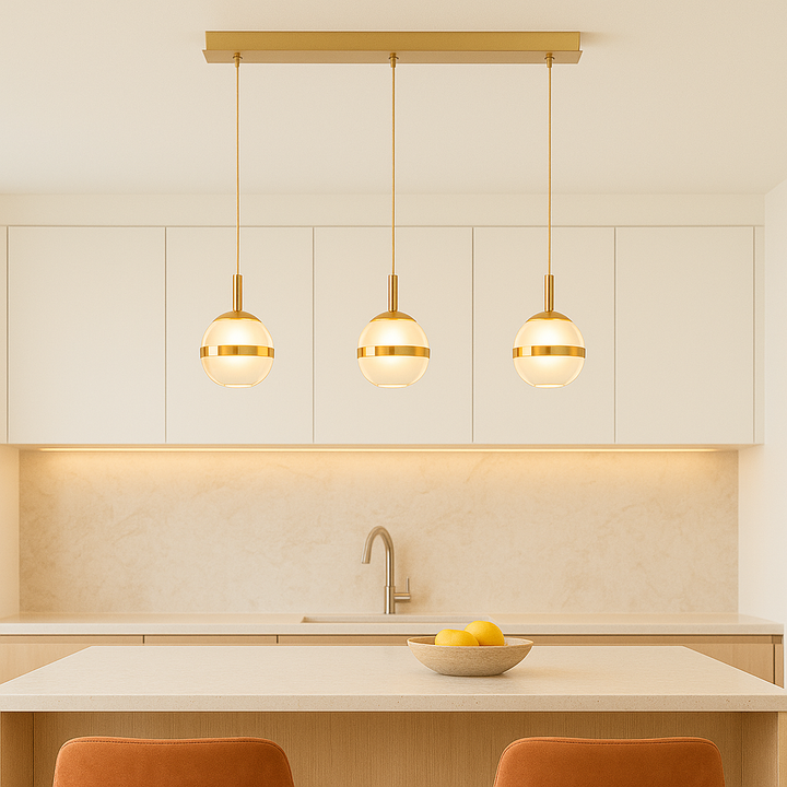 Gold glass pendant bar light with three 12cm globe shades styled above a modern light kitchen island