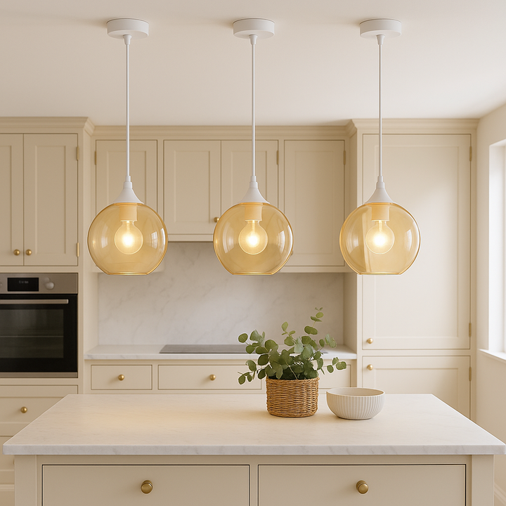 Three Irvine white amber glass pendants above kitchen island