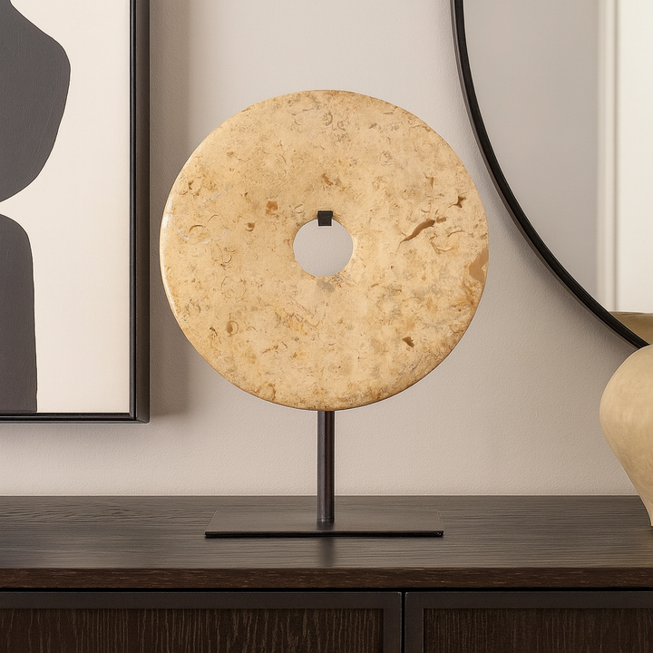 Natural marble ring sculpture on black stand, luxury sideboard décor