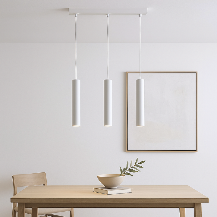Pictou white 3 light cylinder pendant, 45cm wide, styled above a light wood dining table in a Scandi minimal setting with neutral artwork and ceramic bowl.