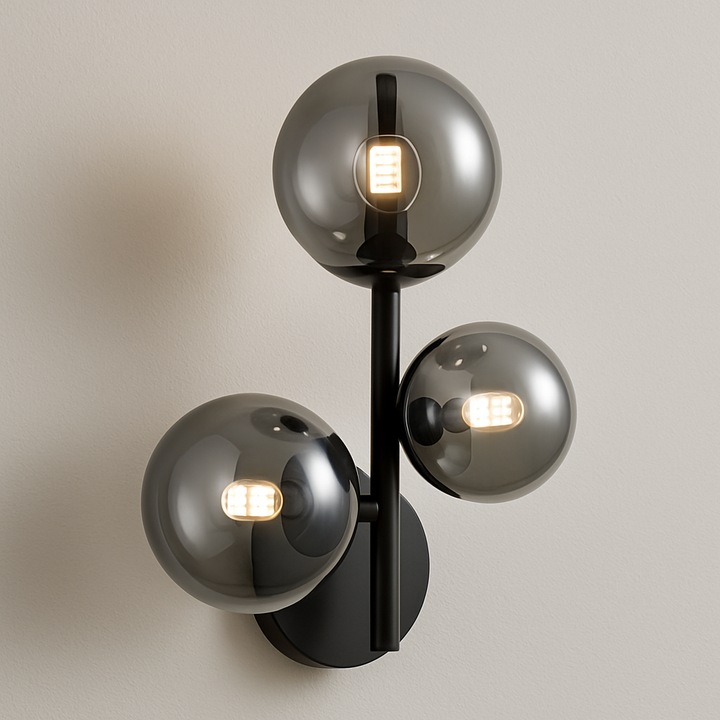 Valetta smoked glass wall light with three globe shades and matt black frame.