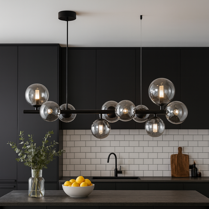 Valetta smoked glass bar pendant in modern black kitchen interior above island.