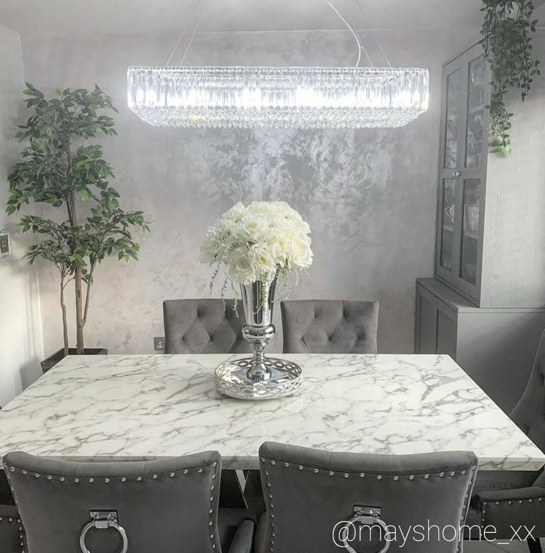 crystal chandelier over dining table for elegant lighting