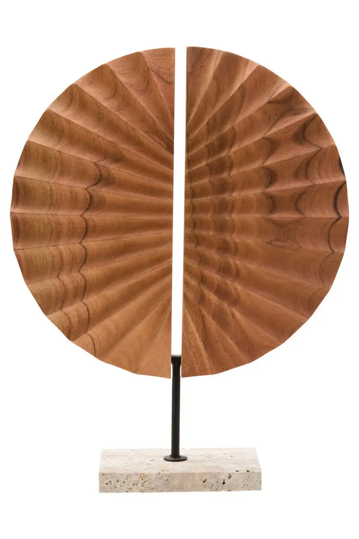 Wooden sculpture with a circular design on a white background