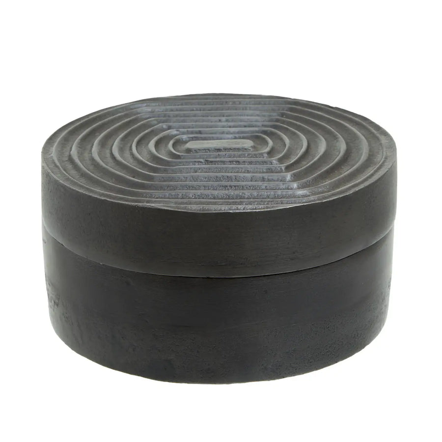 Round black stone box with concentric circular pattern on lid
