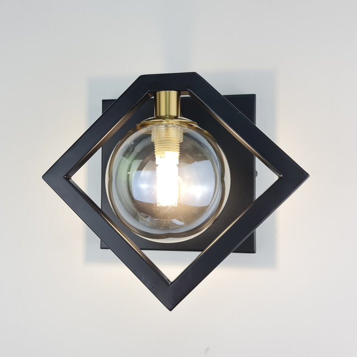 Marlow Black Wall Light With Round Amber Glass Shade