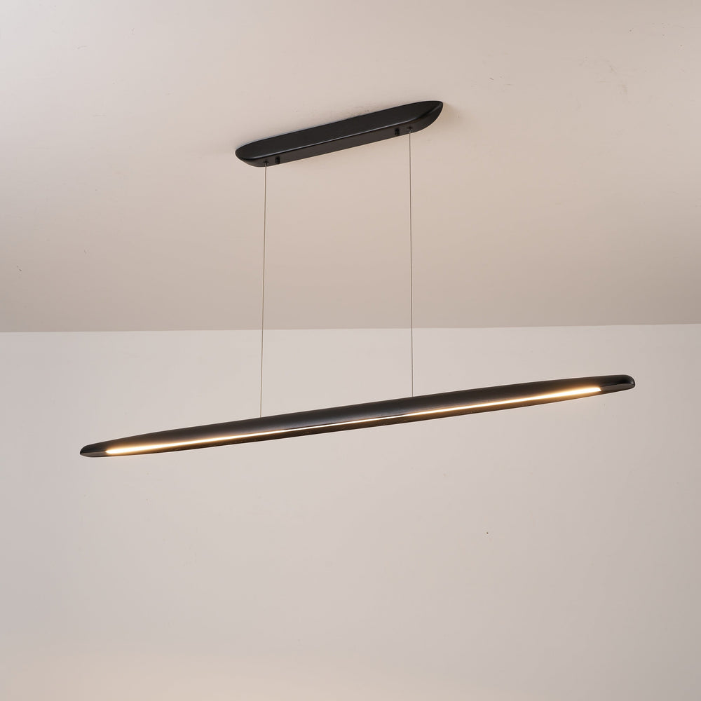 Modern pendant light fixture hanging from a ceiling on a plain background