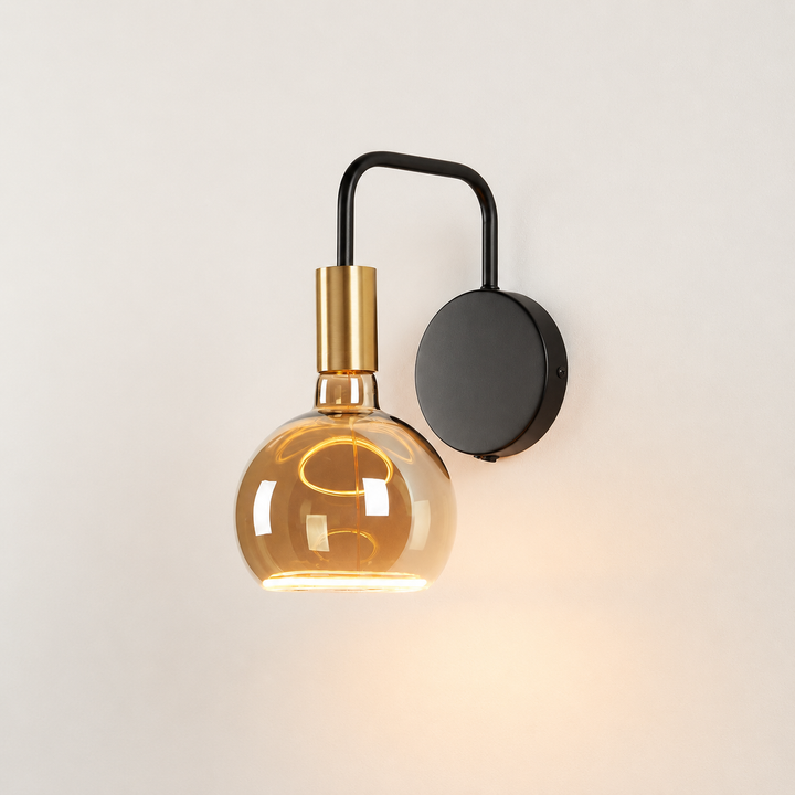 Gold black Roma wall light with amber aura bulb