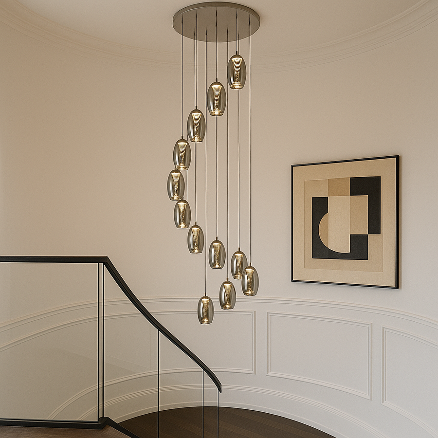 Adelaide 12 light luxury staircase pendant with smoked glass shades in a modern hallway with white walls, black trim and glass balustrade