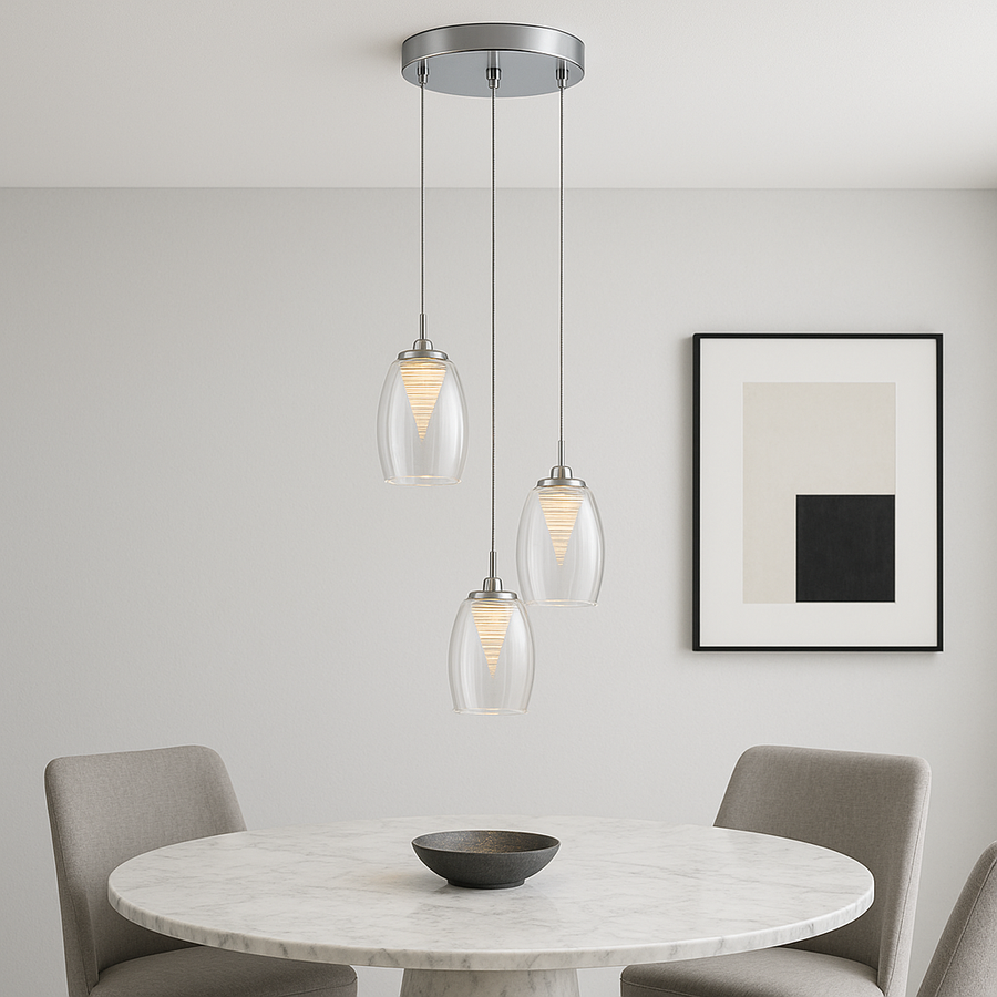 Adelaide 3 light spiral pendant with clear glass shades in a modern dining room above a round marble table
