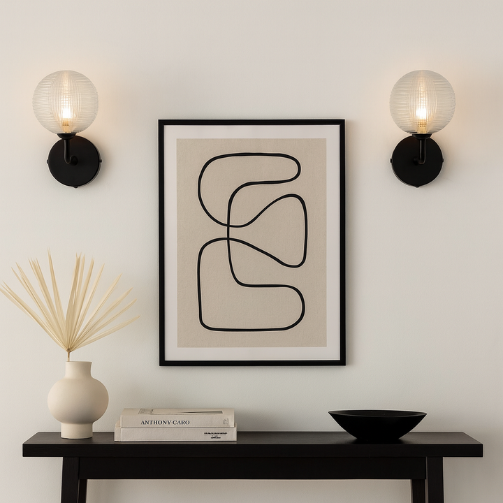 Two Albany black wall lights with console