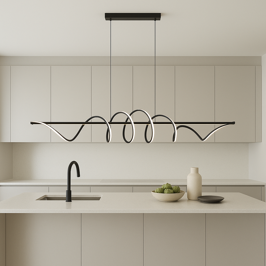 Berlin LED pendant light 111cm wide in modern kitchen with white cabinets, black accents, and large quartz island