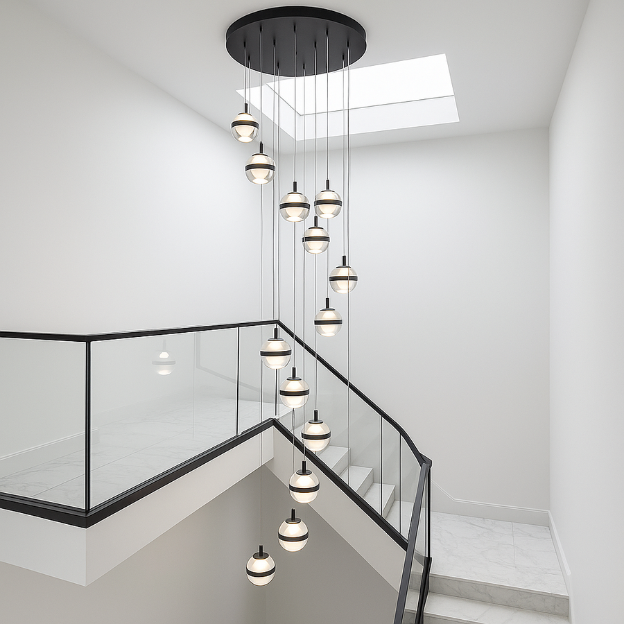 Black 14 light chandelier in a modern stairwell with wraparound staircase