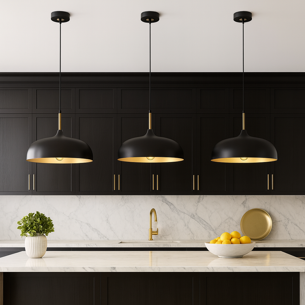 Modern kitchen with three black and gold pendant lights over a large marble island, dark cabinets, and gold accents.