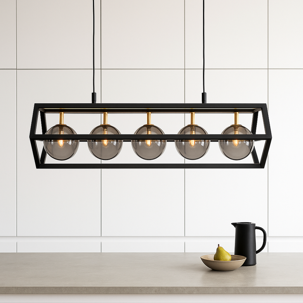 Black and gold rectangular pendant light with smoked glass globes in a modern white handleless kitchen