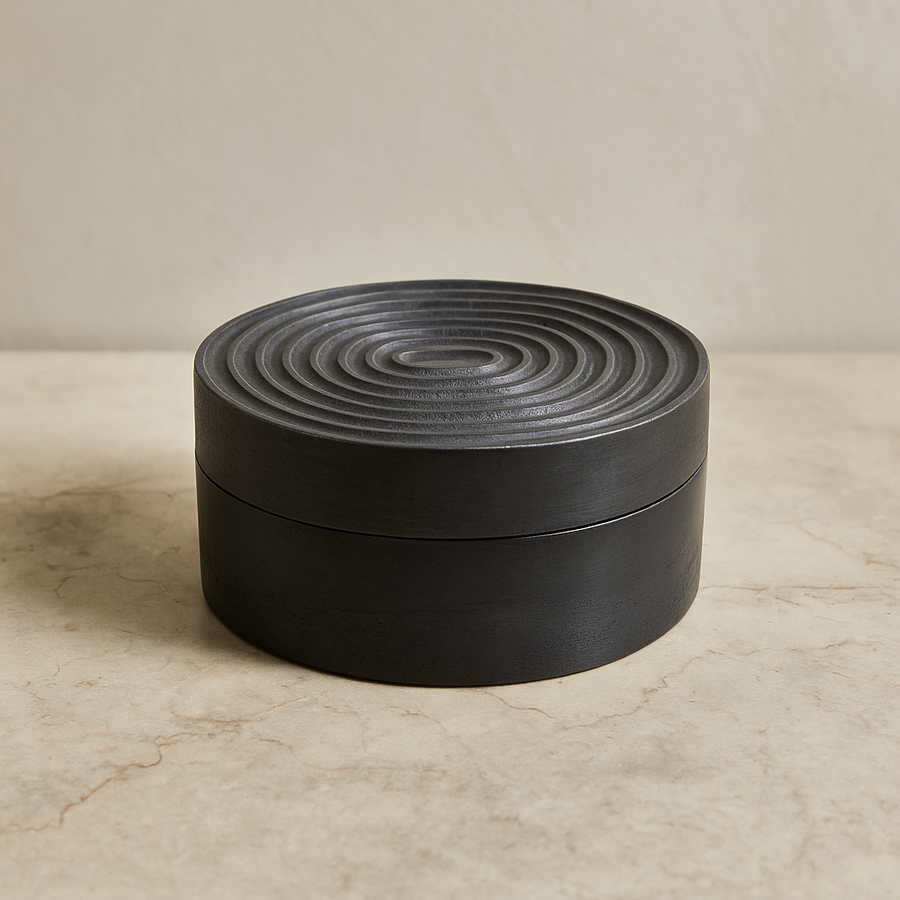 Black round trinket box with ridged lid, modern luxury storage