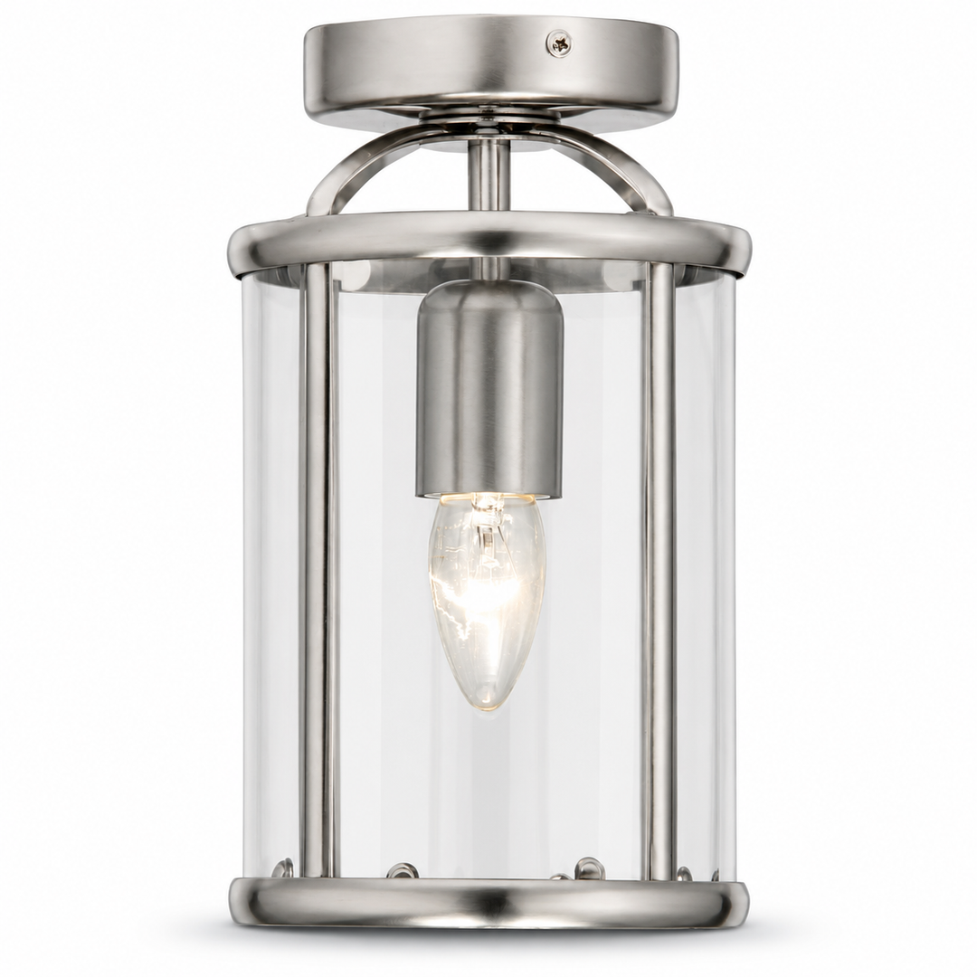 Cambridge satin silver semi flush lantern ceiling light with clear glass panels and candle bulb on a white background.