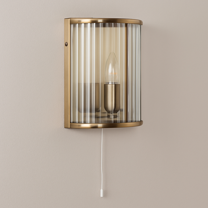 Carlton brass ribbed glass wall light with pull cord turned off