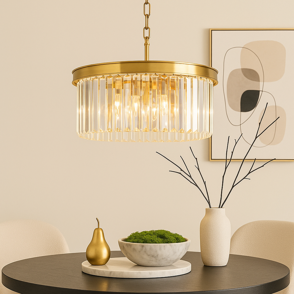 old crystal chandelier above round table with moss bowl and black twig vase