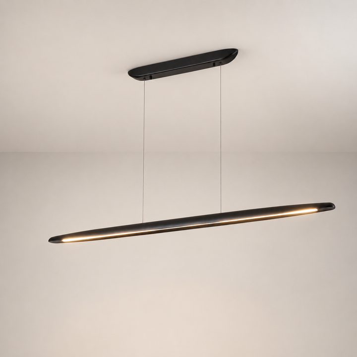 Ceduna Black Wooden LED Kitchen Island Pendant Bar illuminated in a square hero image, showing the slim matt black linear pendant with warm integrated LED light.