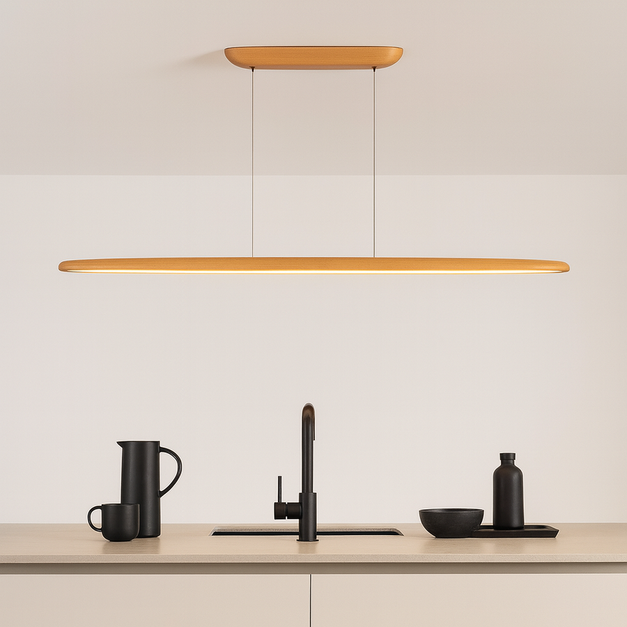 Ceduna Natural Wooden LED Pendant Bar light above a modern Nordic kitchen island with minimalist black accessories.