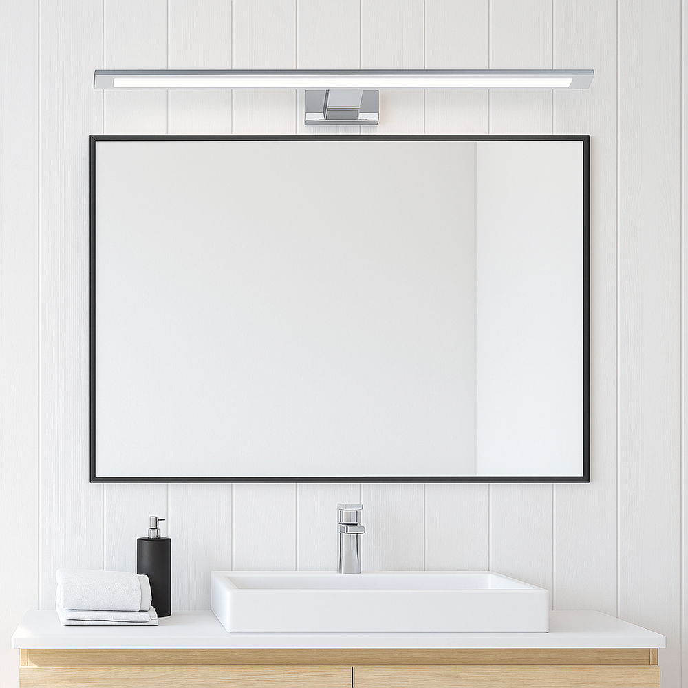 Chrome 60cm Cologne bathroom wall light mounted above a mirror in a light and airy bathroom.