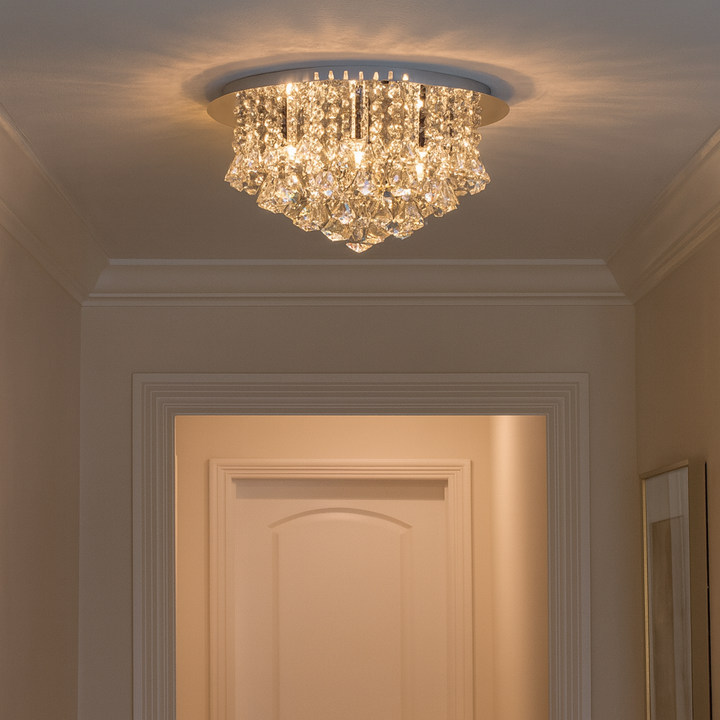 Crystal flush ceiling light with cascading prisms in a modern hallway setting