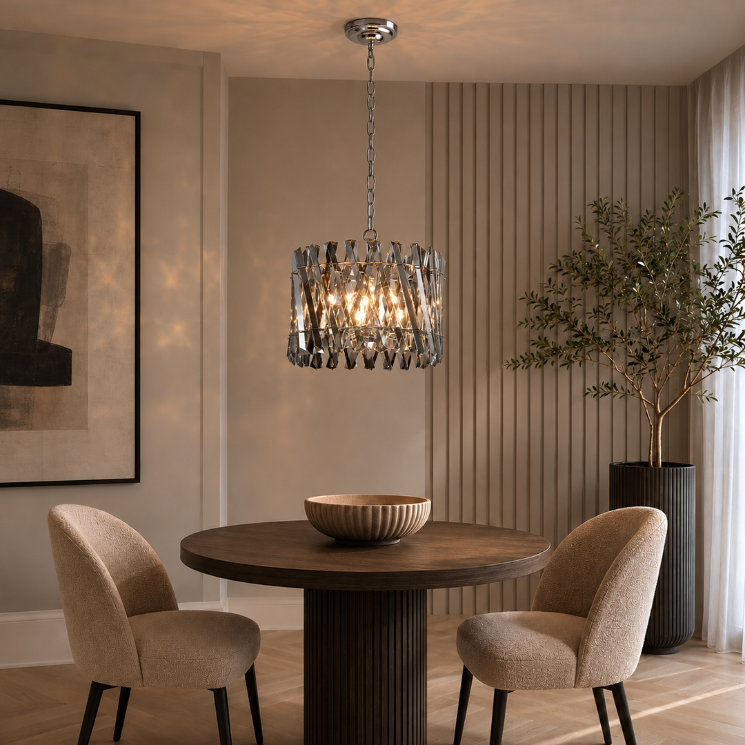 Devonport small smoked crystal chandelier hung above a round dining table in a modern neutral dining nook.