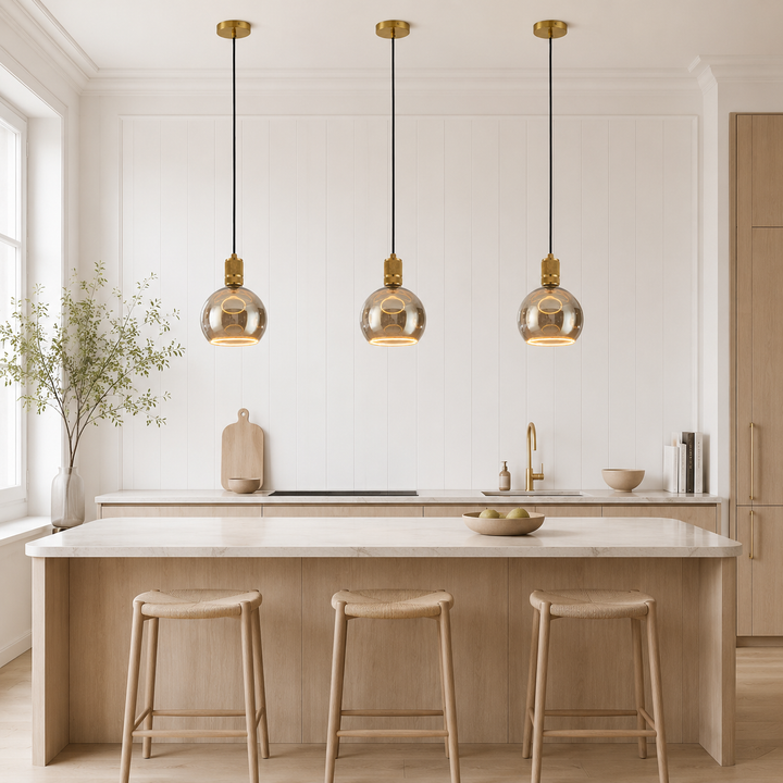 Gold Roma pendant lights above kitchen island