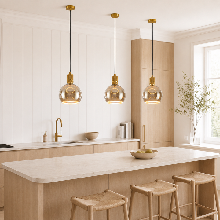 Gold knurled Roma pendants above kitchen island