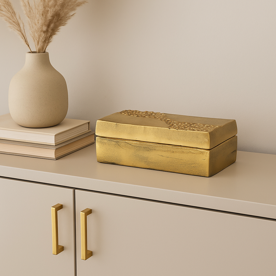 Gold storage box on media unit with gold handles in Scandi living room