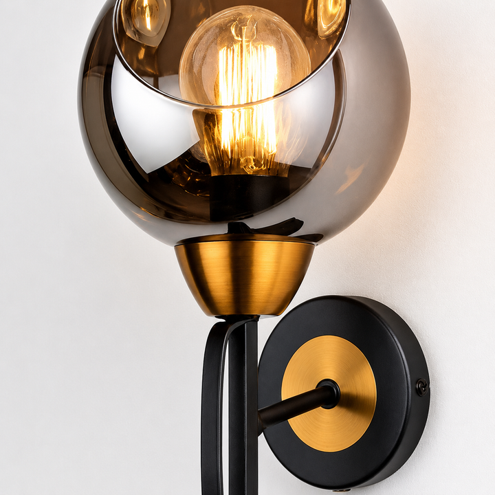 Smoked glass brass wall light close-up
