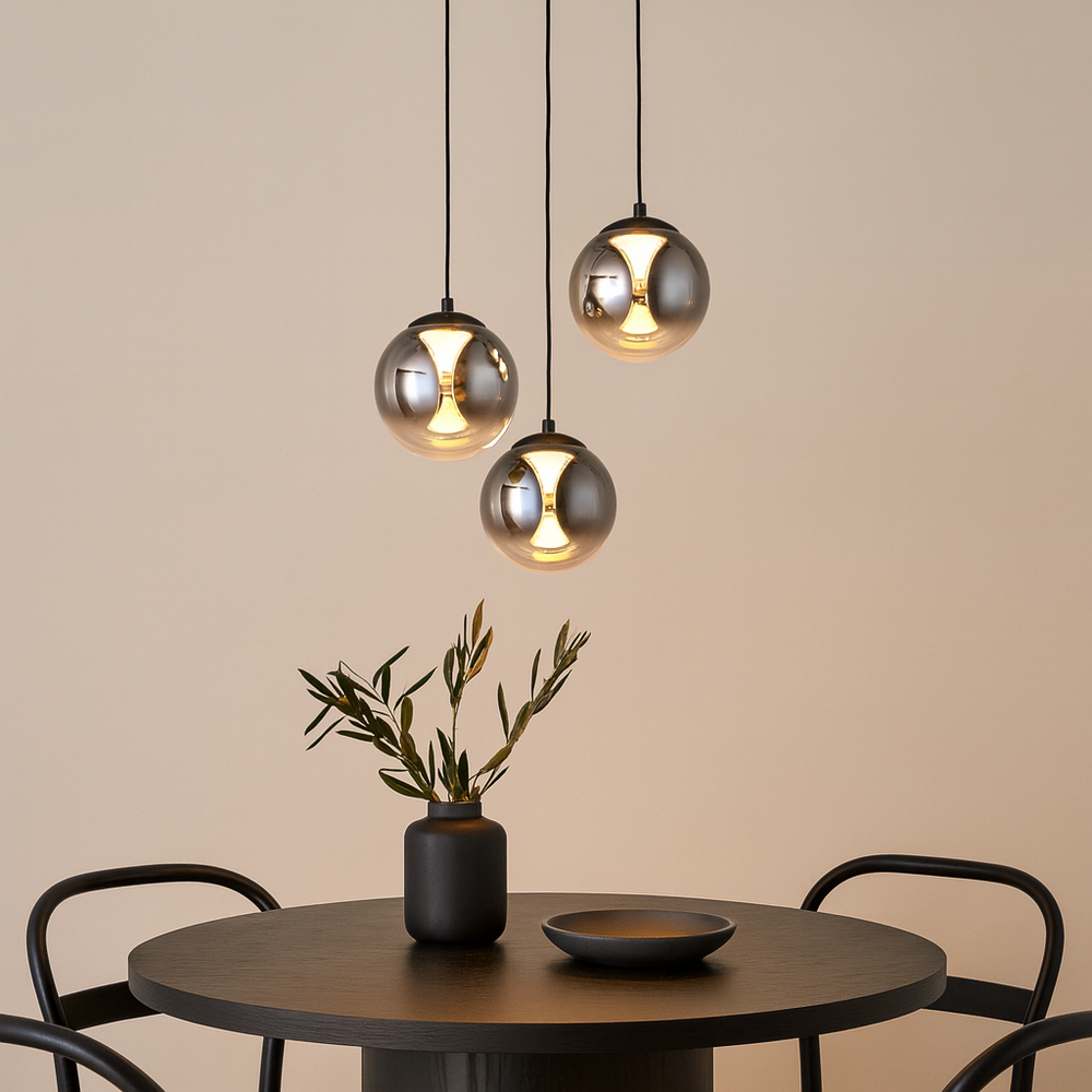 Luxury Havant 3 light smoked glass pendant above a round dining table with black accents.