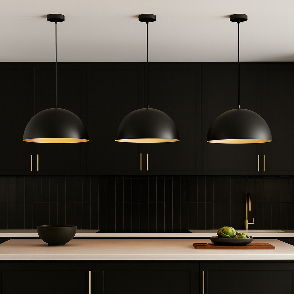 Black dome pendant lights with gold accents above modern black kitchen island