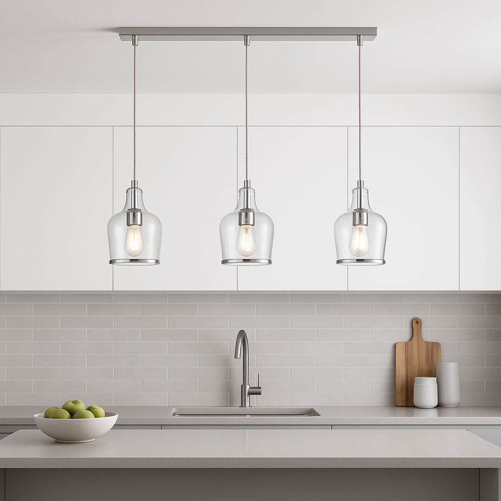 Horsham silver 3 light pendant bar styled above a modern minimalist kitchen island with glass shades