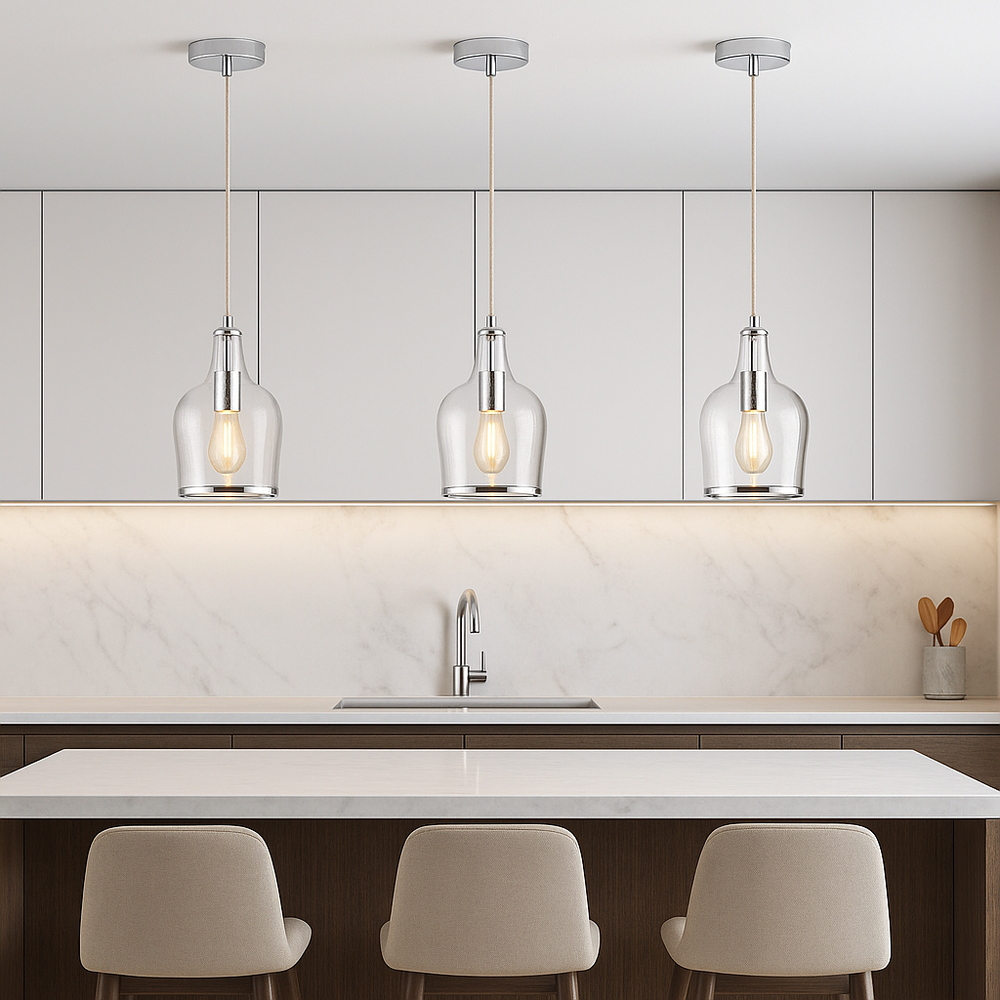 Horsham silver pendant lights in a set of three hanging above a modern marble kitchen island with neutral cabinetry